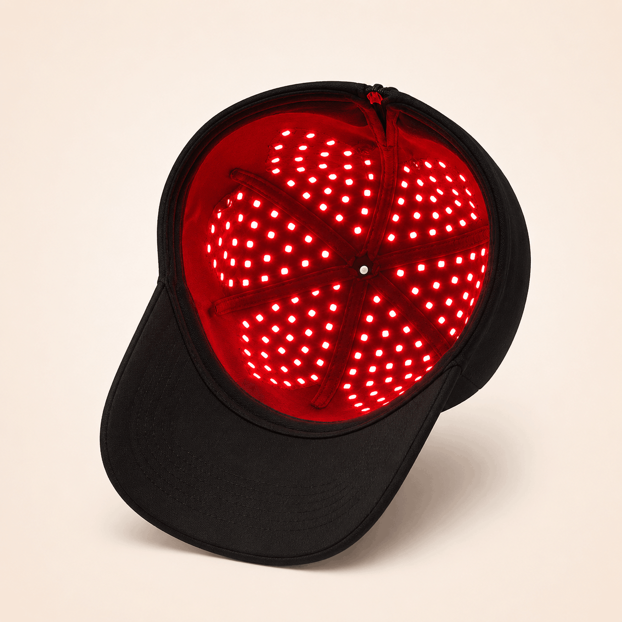 GlowCap Pro being placed on head for at-home hair care